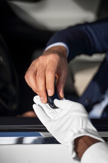 high-angle-hands-holding-key_23-2149901393